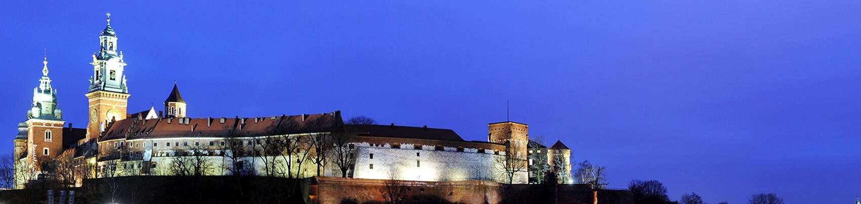 Wawel Castle and the cathedral towers above Krakow at twilight